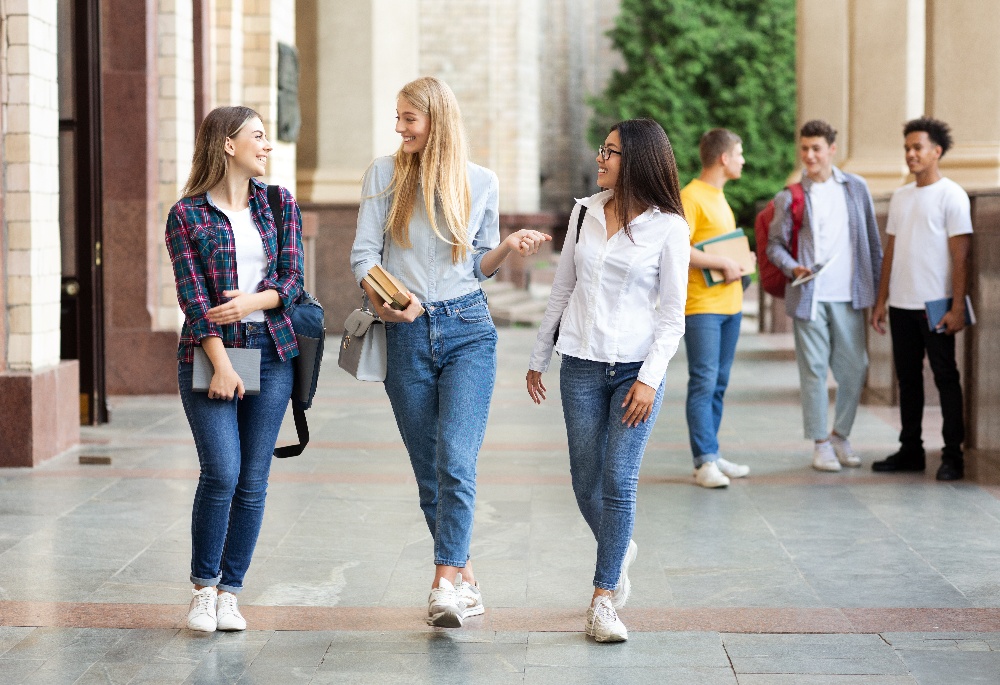 university-life-girls-walking-after-classes-outdoo-7GKMBVT-1